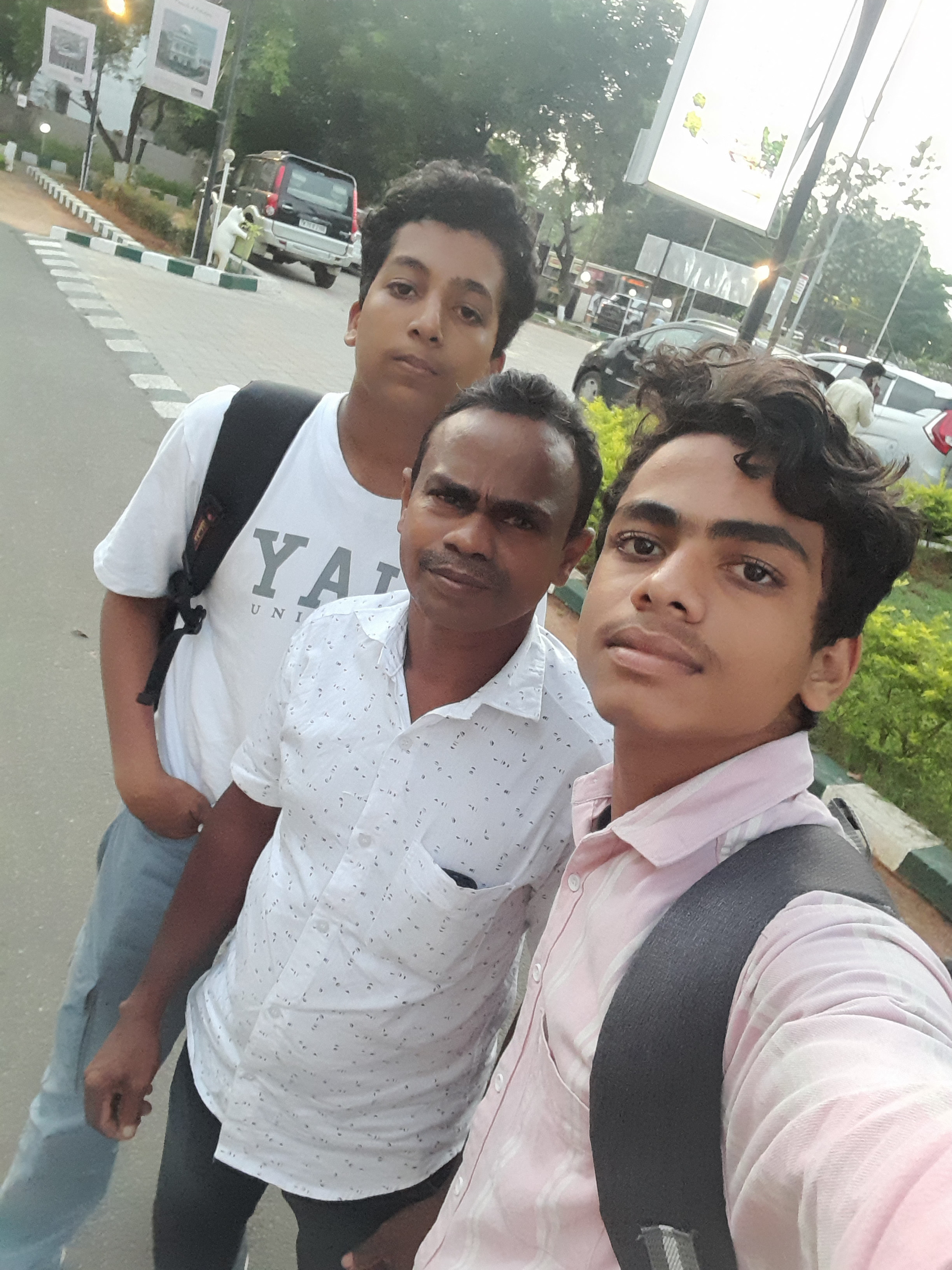 Sajad with his father and friend Mishal outside GDG DevFest Madurai in 2022