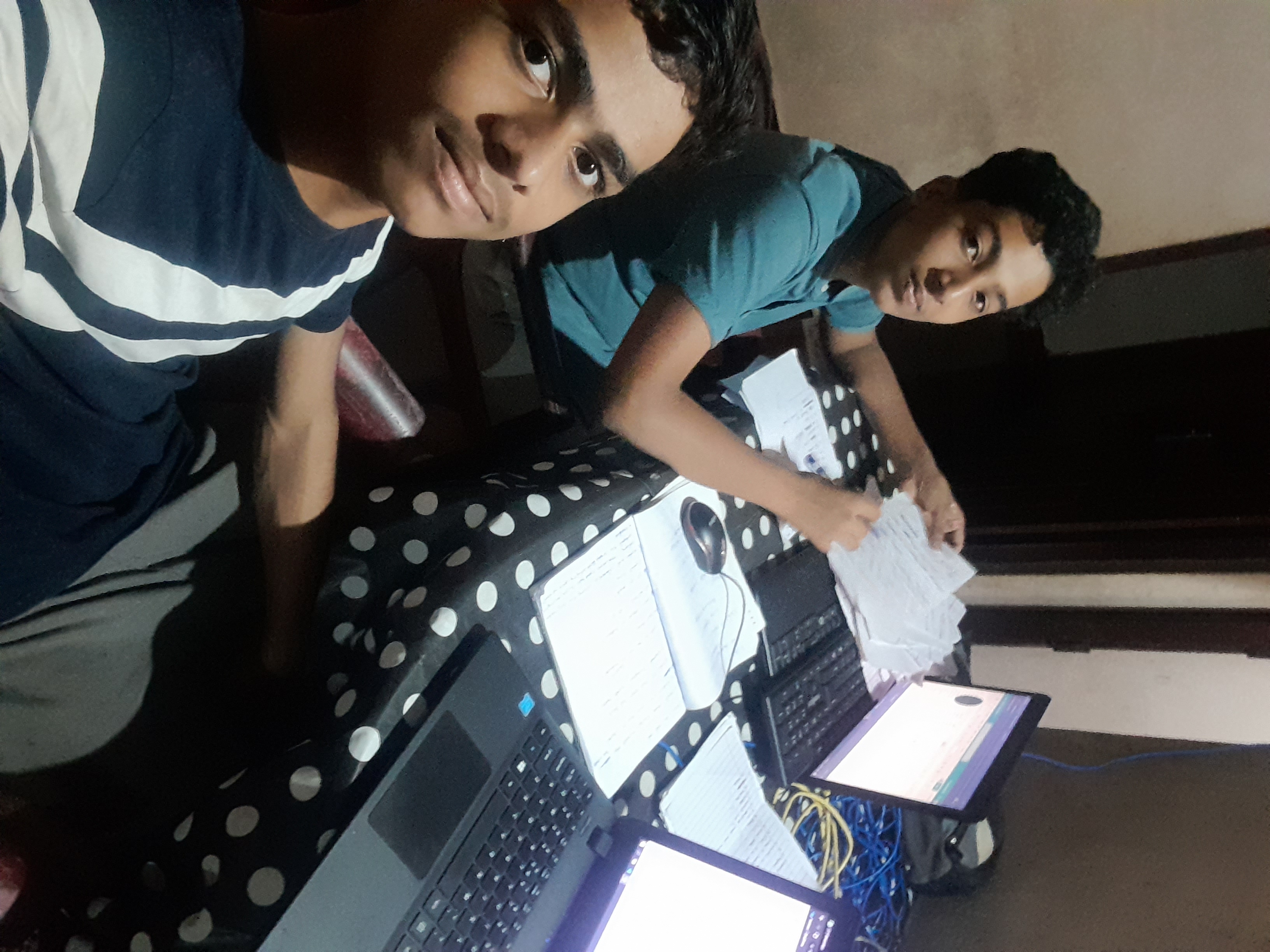 Sajad working with his friend Mishal in 2023