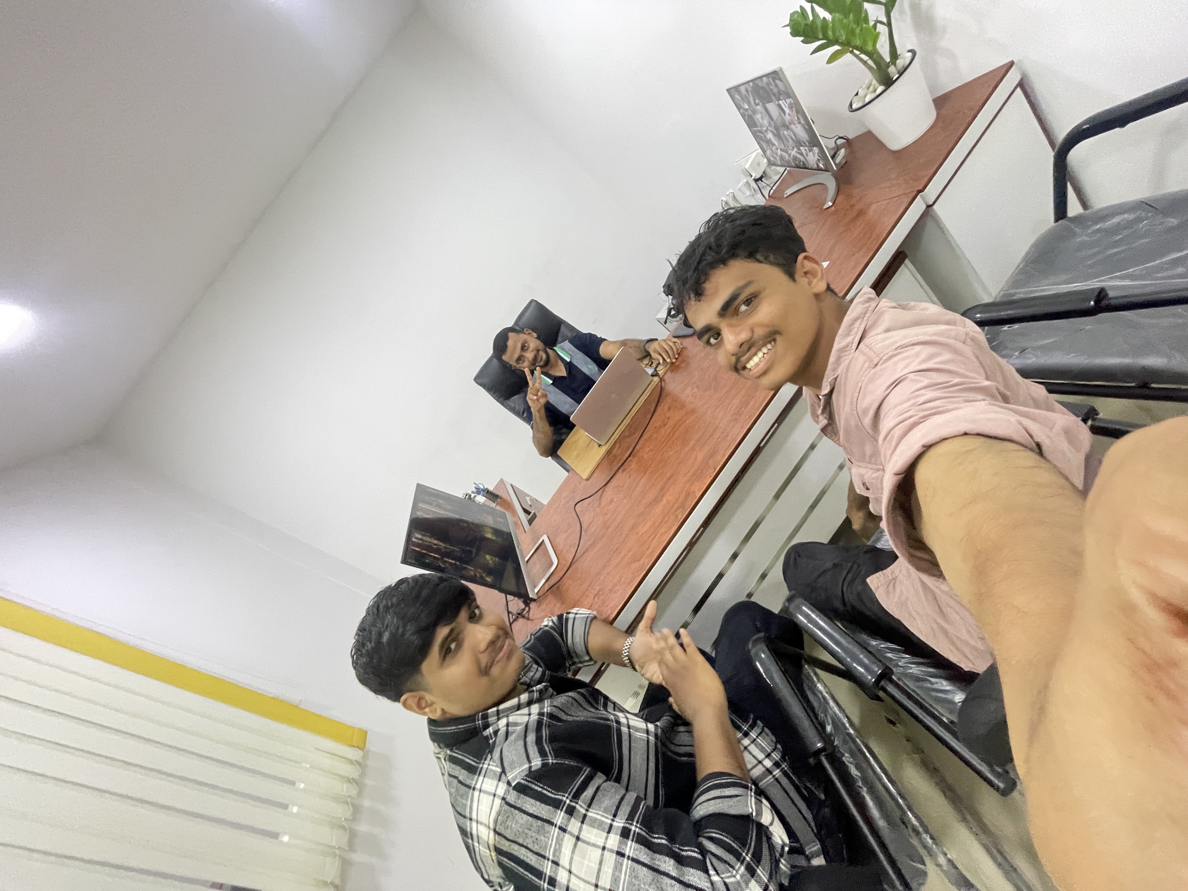 Sajad with his partner and friend Sadiq in 2025, alongside Mujeeb Kolasseri — founder and managing director of Infolks Company, and a family member who gifted Sajad his first laptop, inspiring his journey into technology.